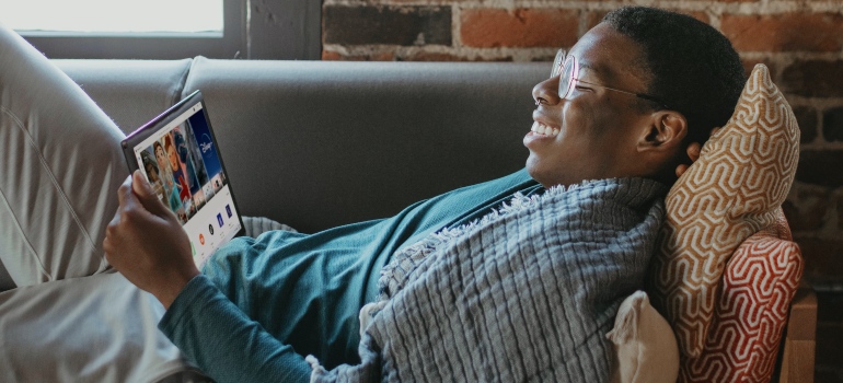 a man reading a tablet 