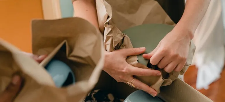 People packing items for storage